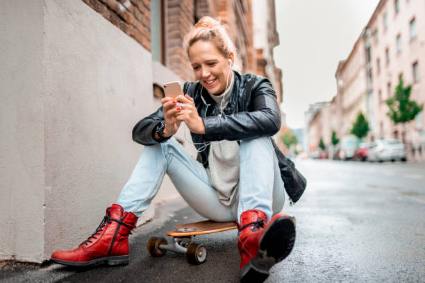 istock Young woman working outdoors with a mobile phone 1043619442