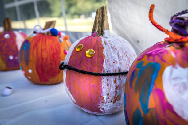 istock Halloween pumpkins painting in the fall 1043627428