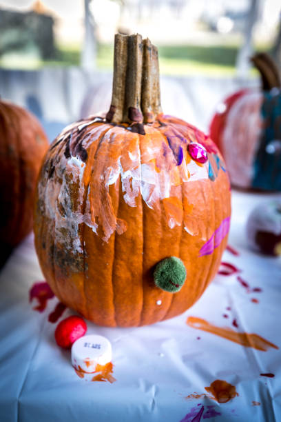 istock Halloween pumpkins painting in the fall 1043627432