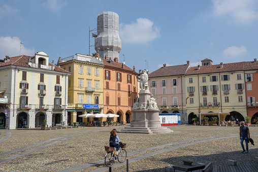 Vercelli, Italy - 8 September 2018: people walking on central Cavour square at Vercelli on Italy