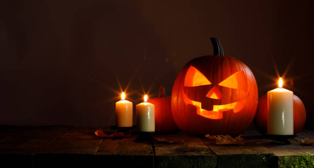 istock Halloween pumpkin and candles 1043630936