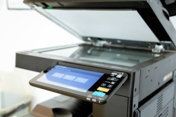 istock Close up paper sheets on the printer in office room. 1043639450