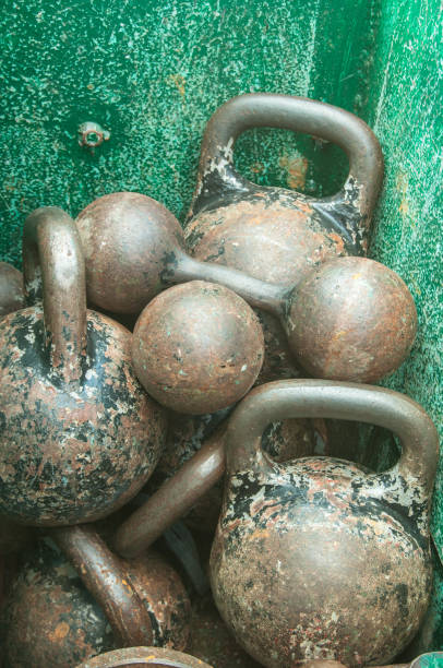 istock Old rusty weights in a green metal box 2 1043639634