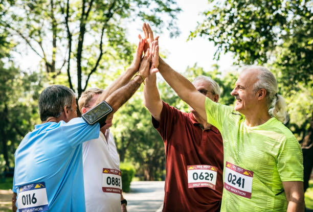istock Group of senior athletes giving a high five 1043640236