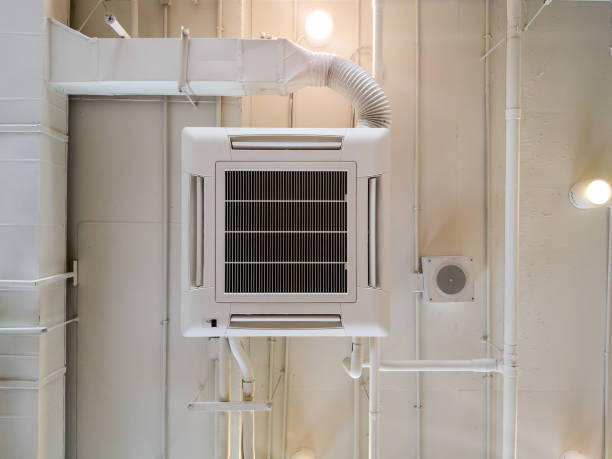 istock White Industrial air conditioner cooling pipe with plumbing at ceiling. Ventilation system ceiling air duct. 1043640298