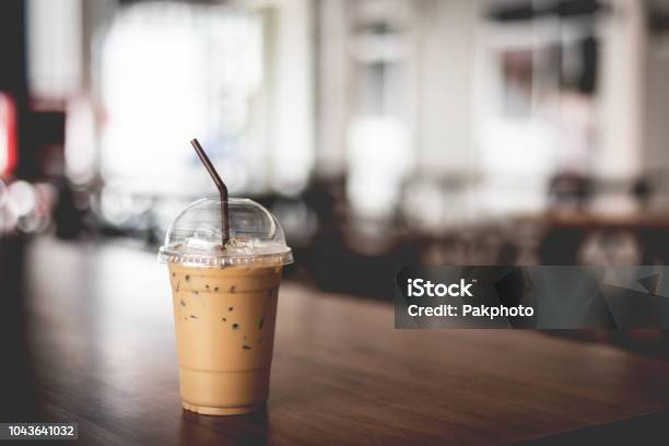 Iced Espresso On The Wooden Table With Nature Light Background Stock Photo - Download Image Now