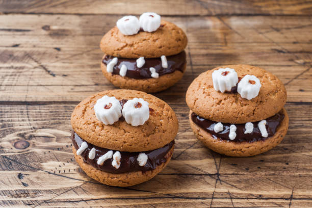 istock Cookies with chocolate paste in the form of monsters for Halloween 1043643962