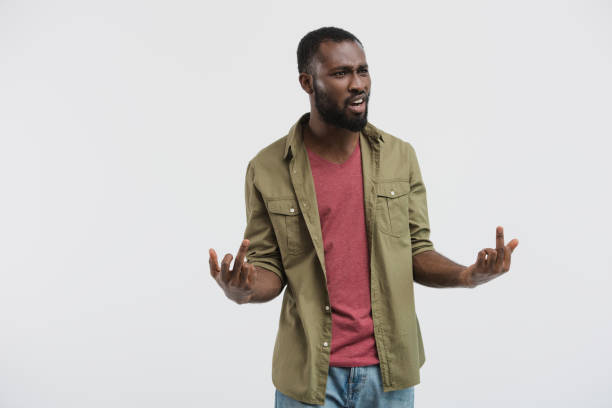 istock aggressive african american man showing middle fingers isolated on white 1043644184