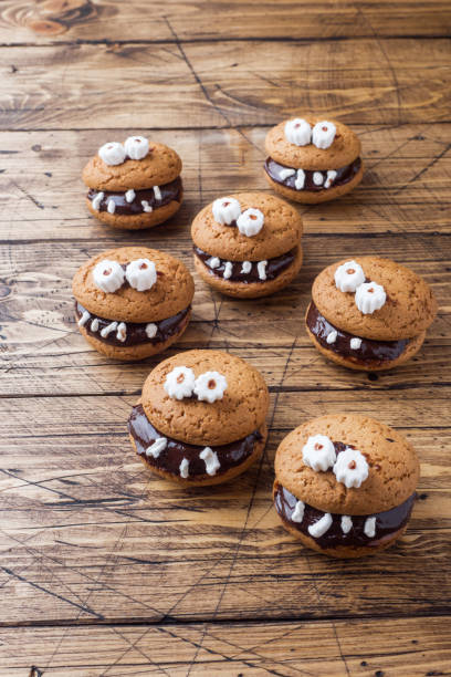 istock Cookies with chocolate paste in the form of monsters for Halloween 1043644568