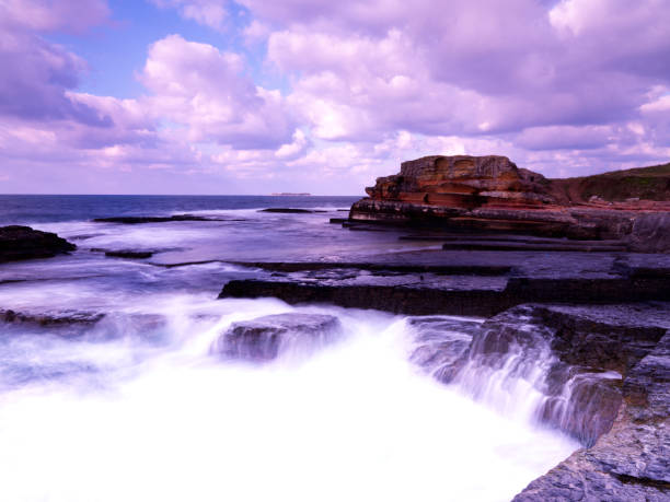 istock long exposure shot with beautiful sea and rocks 1043646018