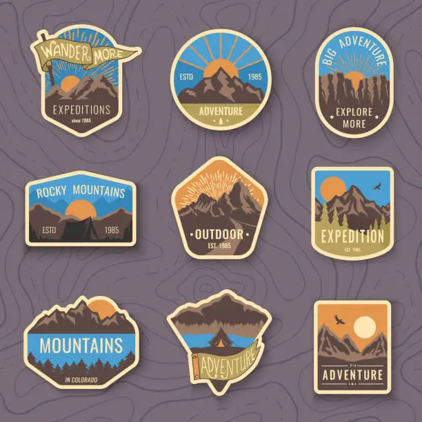 Vector illustration of Set of nine mountain travel emblems. Camping outdoor adventure emblems, badges and logo patches. Mountain tourism, hiking. Forest camp labels in vintage style