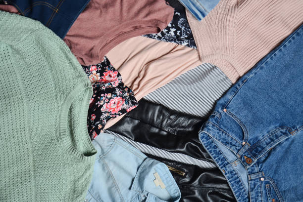 istock Trend clothes and accessories. Top view of many different women's clothing layout. Second hand. Casual Style. 1043648970