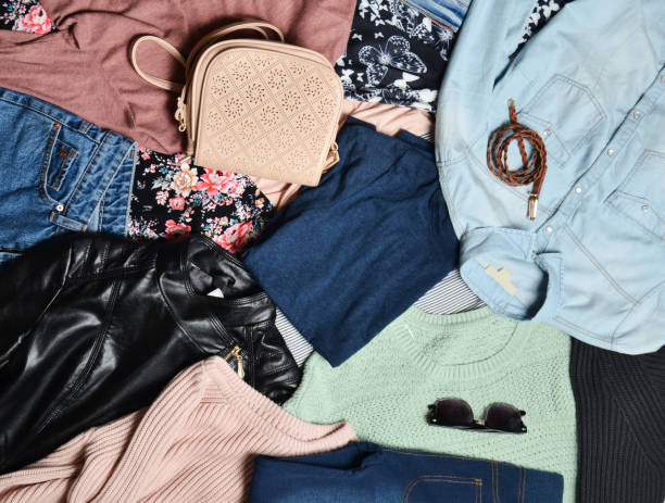 istock Trend clothes and accessories. Top view of many different women's clothing layout. Second hand. Casual Style. 1043648982