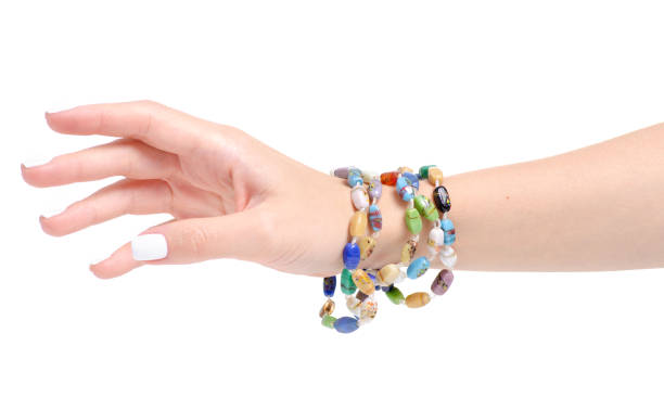 istock Beads colorful stones bracelet in hand 1043651384