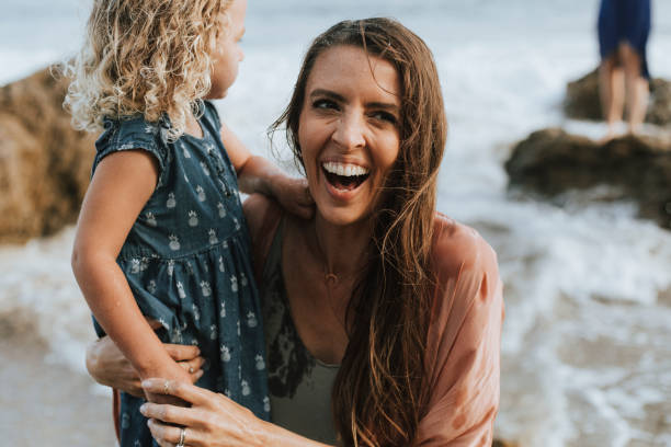istock Mom with young daughter at a beach 1043651480