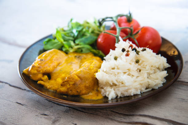 istock Rice and chicken on white plate 1043651624