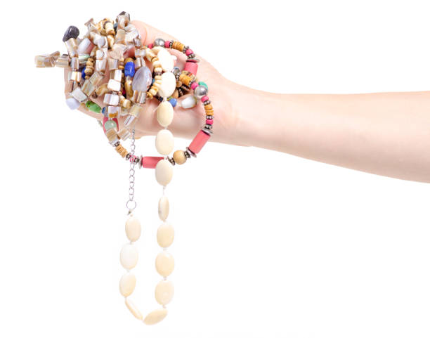 istock Beads stones many colorful different in hand beauty 1043651924