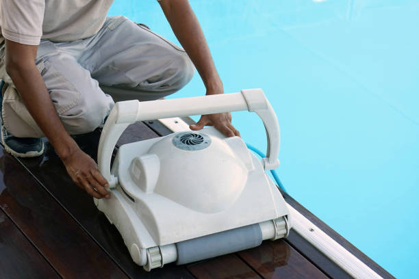 istock Hotel staff worker cleaning the pool 1043652554