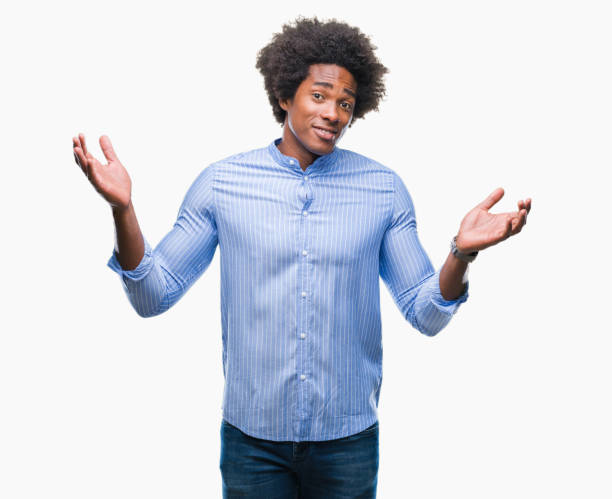 istock Afro american man over isolated background clueless and confused expression with arms and hands raised. Doubt concept. 1043656464