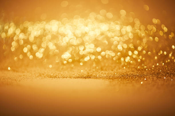 istock bokeh christmas background with golden glitter 1043656710