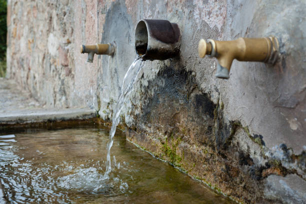 istock Water running on a natural fountain. 1043656724