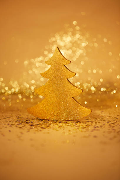 istock golden shiny christmas tree for decoration with glitter 1043657020