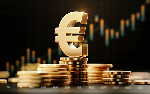 Metallic Euro symbol with financial chart over dark background. Horizontal composition with selective focus and copy space.