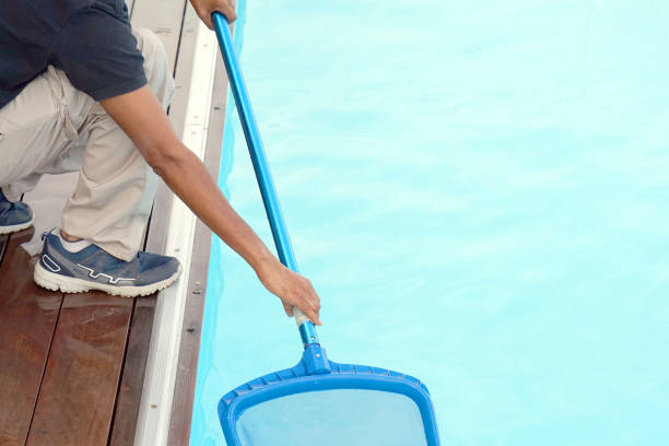 istock Hotel staff worker cleaning the pool 1043658678