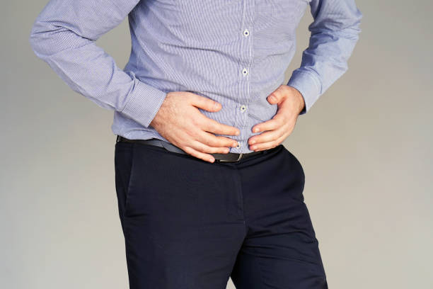 istock Businessman suffering from abdominal pain 1043661342