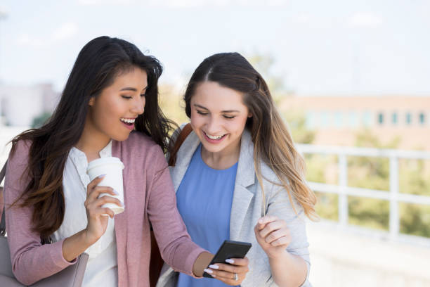 istock Friends looking at smartphone 1043662044
