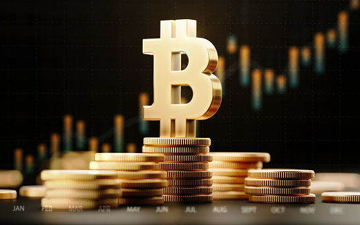 Símbolo de Bitcoin con carta financiera sobre fondo oscuro photo