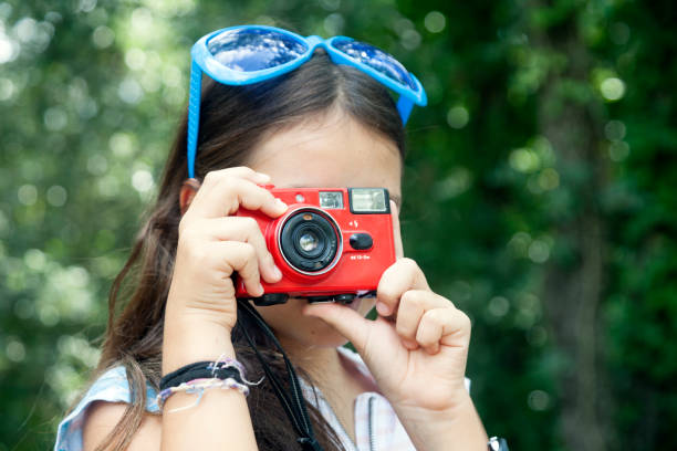 istock Funny little photographer 1043663672