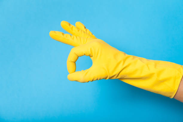 istock Hand in clean yellow glove, bathroom 1043667766