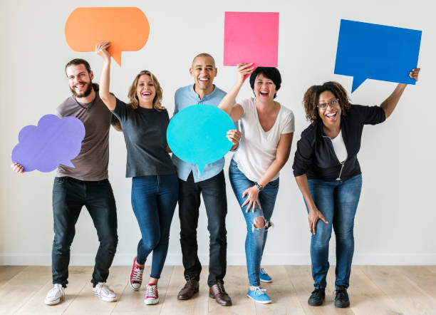 istock People carrying speech bubble icons 1043668656