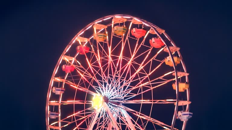 Ferris Wheel Carnival Ride Turning at Night