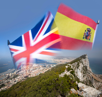 The Union Jack and the Flag of Spain montaged onto The Rock of Gibraltar in the background, indicating the dispute over its sovereignty