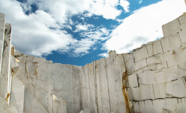 white marble quarry under the blue sky - quarry imagens e fotografias de stock