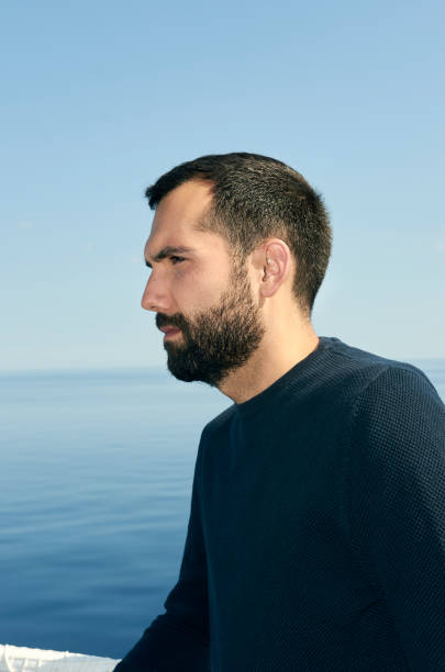 istock Handsome man on the deck of a ship during holiday. 1043677770