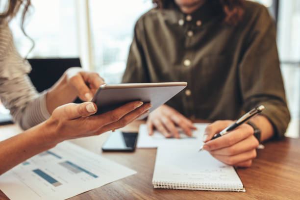 istock Business colleagues discussing work in office 1043682860