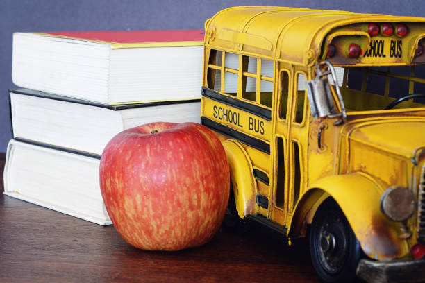 istock Books, apple, crayons and student bus 1043684474