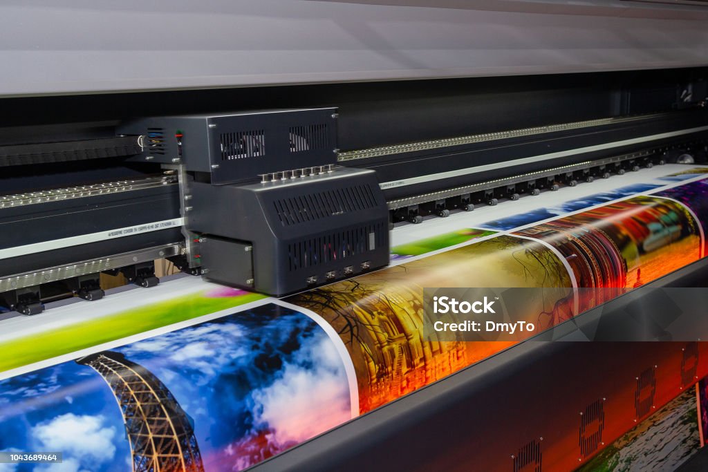 Large format printing machine in operation. Industry Track - Imprint Stock Photo