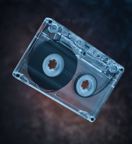istock Audio cassette levitation. Retro media technology from the 80s. Mystical light. 1043693760