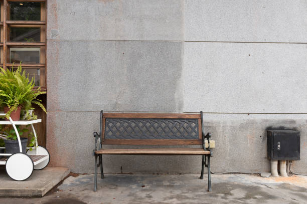 istock Lonely wooden bench in the park 1043698912
