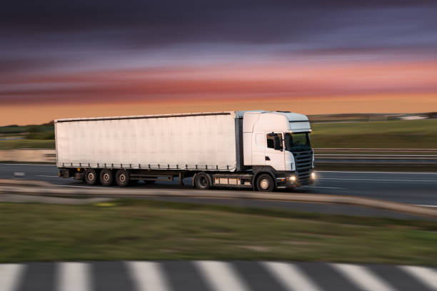 istock Truck with container on road, cargo transportation concept. 1043699804