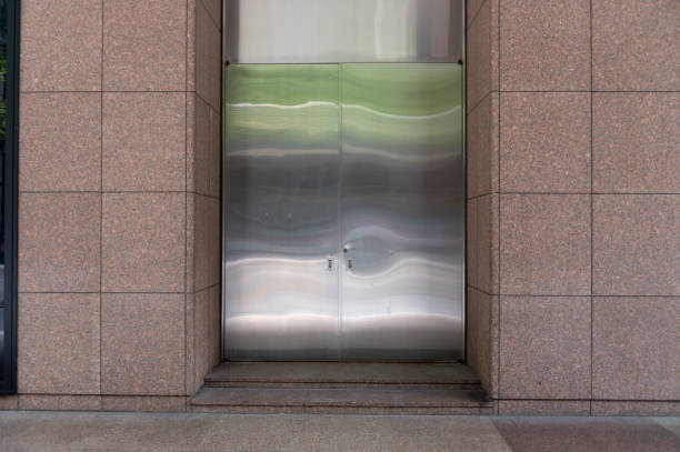 istock sidewalk by street wall & door 1043700624
