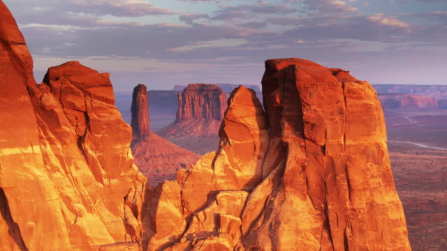 Monument Valley Buttes in Red Sunset Light - Drone Shot