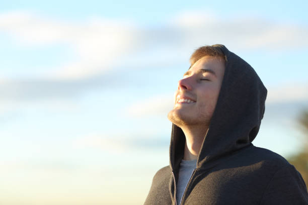 teenage boy breathing deep fresh air - activity sport teenager nature imagens e fotografias de stock