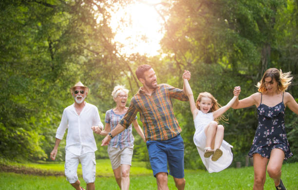 istock Happy multi-generation family running in nature. 1043710146