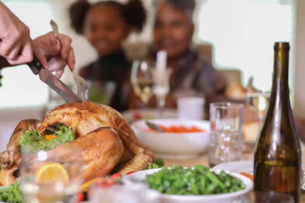 istock Roasted turkey on platter during Thanksgiving dinner. 1043710314