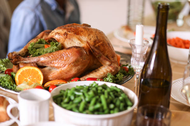 istock Roasted turkey on platter during Thanksgiving dinner. 1043710362